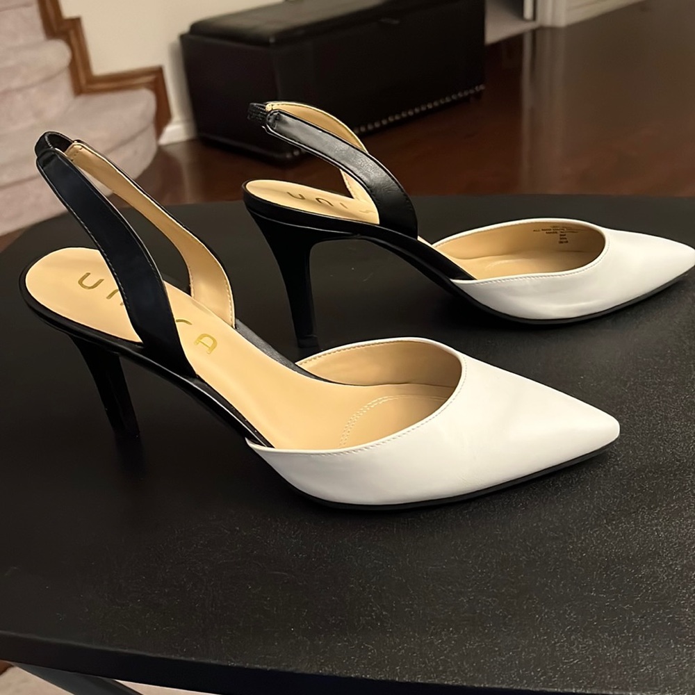White and black sling backs made by Unisa size 9.